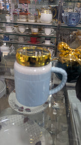 Light Blue Ribbed Ceramic Mug with Gold-Rimmed Lid